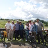 A group enjoying a photo stop during an e-bike tour in Saint-Émilion